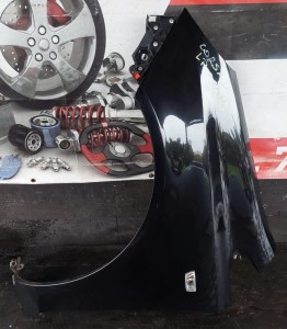 BŁOTNIK LEWY PRZÓD OPEL CORSA D Z20R